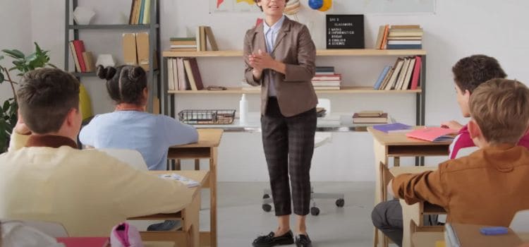 classroom setting with a teacher standing at the front